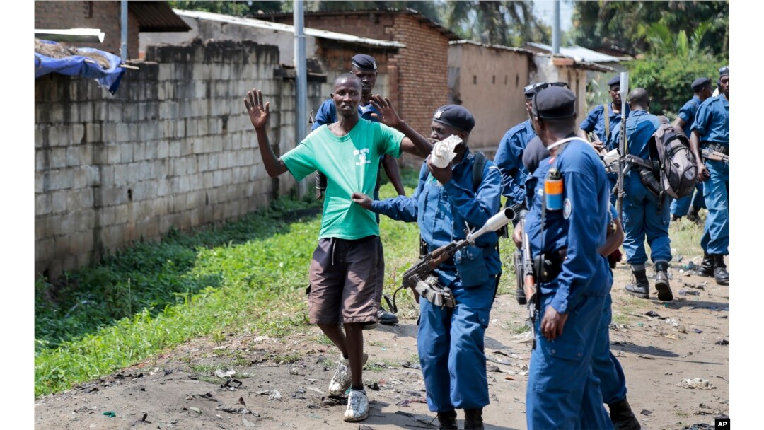 FILE - Burundian police arrest a demonstrator during clashes with security forces in the Cibitoke district of the capital Bujumbura, Burundi, May 29, 2015.