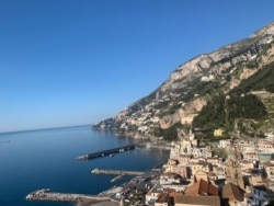 Coastline with empty Amalfi port. (Sabina Castelfranco/VOA)