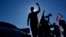 FILE - Students block a highway as they protest President Javier Milei's veto of a law to increase funding for public universities in Buenos Aires, Argentina, Oct. 16, 2024. 