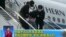 People being deported from Thailand are seen brought off an airplane by police at an unidentified location in China on July 9, 2015 in this still image taken from CCTV video aired on July 11, 2015. 