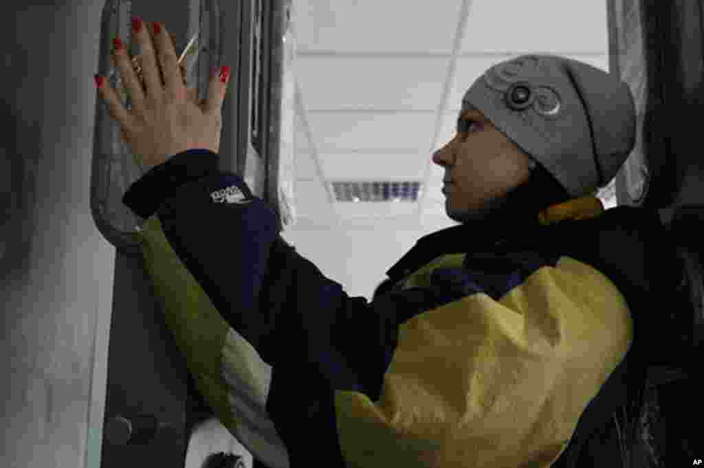 After a day touring Chernobyl, visitors test for radiation before dinner. (VOA Photo/D. Markosian)