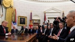 President Donald Trump, left, holds a meeting with Chinese Vice Premier Liu He, right, in the Oval Office of the White House in Washington, Jan. 31, 2019.