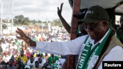 FILE — Liberia's President-Elect Joseph Boakai waves to his supporters as holds his final campaign rally for the presidential elections in Monrovia, Liberia, Oct. 7, 2023. 