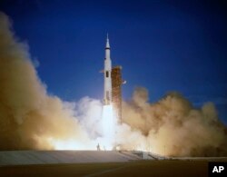 FILE - The Apollo 8 crew lifts off from the Kennedy Space Center in Florida, Dec. 21, 1968.