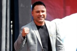 FILE- Boxer Oscar De La Hoya is pictured during a press conference in Mexico City, March 1, 2019. De La Hoya’s return to the ring has been postponed because he tested positive for COVID-19.