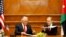 U.S. Secretary of State Rex Tillerson and Jordanian Foreign Minister Ayman Safadi sign agreements in Amman, Feb. 14, 2018. 
