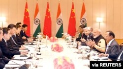 India's Prime Minister Narendra Modi (3rd R) and China's President Xi Jinping (3rd L) lead talks in Mamallapuram, on the outskirts of Chennai, India, Oct. 12, 2019.