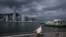 A man looks up on a promenade at Victoria Harbor in Hong Kong on Sept. 5, 2024, as super typhoon Yagi tracked across the South China Sea toward the southern China coast.