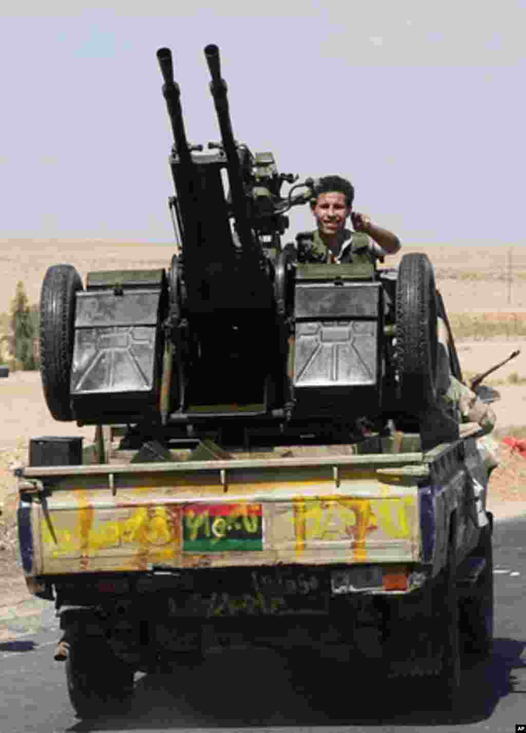 An NTC fighter outside Bani Walid heads to front, Libya, September, 10, 2011. - E. Arrott