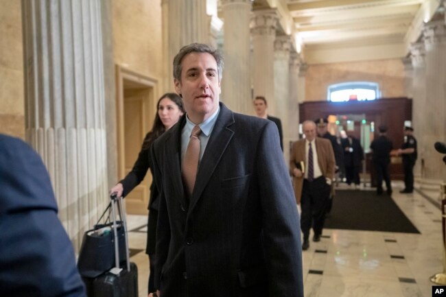 FILE - Michael Cohen, President Donald Trump's former lawyer, returns to Capitol Hill for a fourth day of testimony as Democrats pursue a flurry of investigations into Trump's White House, businesses and presidential campaign, in Washington, March 6, 2019.