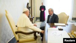 Pope Francis meets Libero Milone (R), the Vatican's auditor general, at the Vatican, April 1, 2016.