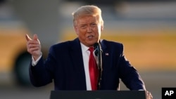 President Donald Trump speaks during a campaign rally at Manchester-Boston Regional Airport, Friday, Aug. 28, 2020, in Londonderry, N.H. (AP Photo/Charles Krupa)