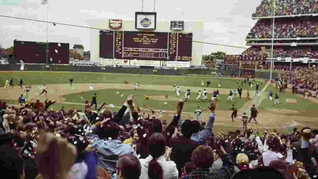 The New York Mets run onto the field to celebrate their World Series win over the Baltimore Orioles at Shea Stadium in New York, Oct. 16, 1969 as the fans cheer in the stands. The Mets were founded in 1962 and had been one of the worst teams in baseball until 1969.