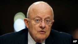 FILE - Director of the National Intelligence James Clapper speaks on Capitol Hill in Washington. 