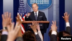 FILE - White House Press Secretary Sean Spicer takes a question during a press briefing at the White House in Washington, May 30, 2017.