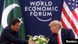 U.S. President Donald Trump shakes hands with Pakistan's Prime Minister Imran Khan during a bilateral meeting at the 50th World Economic Forum annual meeting in Davos, Switzerland, Jan. 21, 2020.