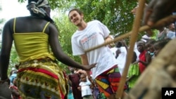 Tribe members and locals dance together at the launch of
TribeWanted, an ecotourism venture set up on John Obey beach, 80km
south of the capital, Freetown