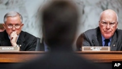 Senate Judiciary Committee Chairman Patrick Leahy (R) and committee ranking member Sen. Jeff Sessions (L) listen to Homeland Security Secretary Janet Napolitano testify 09 Dec 2009 on Capitol Hill