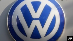 The VW sign of Germany's car company Volkswagen in, Berlin, Oct. 5, 2015.