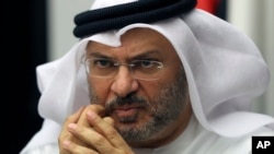 FILE - Anwar Gargash, UAE foreign minister, is pictured talking to reporters in Dubai, June 24, 2017.