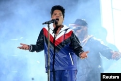 FILE - Bruno Mars performs at the 59th Annual Grammy Awards in Los Angeles, California.