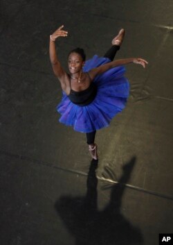 FILE - In this July 10, 2012, photo, dancer Michaela DePrince rehearses for her lead role in "Le Corsaire" in Johannesburg.