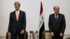 Iraqi Prime Minister Nouri al-Maliki, right, and U.S. Secretary of State John Kerry meet at the Prime Minister's Office in Baghdad, Iraq, June 23, 2014. 