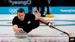 FILE - Russian curler Alexander Krushelnitsky practices ahead of the 2018 Winter Olympics in Gangneung, South Korea, Feb. 7, 2018.