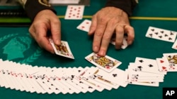 FILE - Blackjack deck reset at Caesars Palace in Las Vegas.