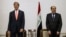 Iraqi Prime Minister Nouri al-Maliki, right, and U.S. Secretary of State John Kerry meet at the Prime Minister's Office in Baghdad, Iraq, June 23, 2014. 