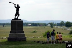 FILE - A monument sits atop a ridge held by Union troops, above the field of Pickett's Charge, Wednesday, June 5, 2013, in Gettysburg, Pa.