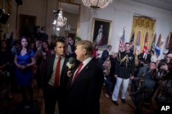 FILE - "Fox and Friends" co-host Pete Hegseth interviews President Donald Trump at an event in the White House in Washington on April 6, 2017. Hegseth is Trump's choice to be secretary of defense, the president-elect announced on Nov. 13, 2024.