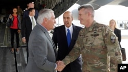 Secretary of State Rex Tillerson is greeted by Gen. John Nicholson, right, commander of Resolute Support, with Special Charge d'Affaires Amb. Hugo Llorens, as he arrives, Oct. 23, 2017, at Bagram Air Base, Afghanistan.