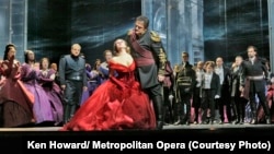 Enraged by Iago’s lies about Desdemona’s faithfulness, Otello (Aleksandrs Antonenko) loses control and insults her in front of the Venetian court. (Credit: Ken Howard/ Metropolitan Opera)