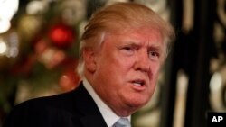 President-elect Donald Trump speaks to reporters at Mar-a-Lago, Dec. 28, 2016, in Palm Beach, Fla. 