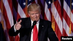 FILE - U.S. President-elect Donald Trump greets supporters during his election night rally in Manhattan, New York, Nov. 9, 2016. 