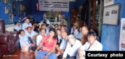 Mami Yuli (center, in red shirt) and elderly trans women pose for a photo at the FKWI shelter. (Courtesy - FKWI)