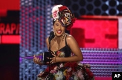 Cardi B accepts the award for favorite rap/hip-hop artist at the American Music Awards, Oct. 9, 2018, at the Microsoft Theater in Los Angeles.