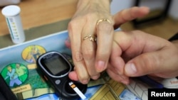 Diabetics test their blood sugar.