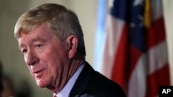 Former Massachusetts Gov. William Weld addresses a gathering during a New England Council "Politics & Eggs" breakfast in Bedford, N.H., Feb. 15, 2019. Weld announced he's creating a presidential exploratory committee for a run in the 2020 election.