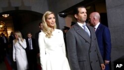 FILE - Ivanka Trump, left, and Donald Trump Jr. arrive at the U.S. Capitol in Washington for the inauguration of their father Donald J. Trump as the 45th U.S. president, Jan. 20, 2017. Both are expected to take the witness stand during their father's civil fraud trial.