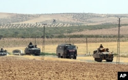 FILE - Turkish troops return from the Syrian border, in Karkamis, Turkey, Aug. 27, 2016. Turkey on Wednesday sent tanks across the border to help Syrian rebels retake the key Islamic State-held town of Jarablus.