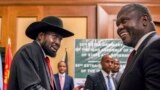 FILE - South Sudan's President Salva Kiir, left, and opposition leader Riek Machar shake hands during talks in Addis Ababa, Ethiopia, June 21, 2018. U.S. aid is being tied to implementation of the peace deal, U.S. ambassador to Juba said July 14, 2020.