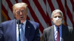 U.S. President Donald Trump speaks about administration efforts to develop a vaccine as National Institute of Allergy and Infectious Diseases Director Dr. Anthony Fauci listens during a coronavirus disease (COVID-19) pandemic response event