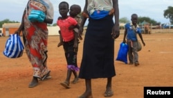 A South Sudan refugee family arrives at the UNHCR managed refugees reception point at Elegu, near the South Sudan-Uganda border, Aug. 20, 2016. Calls for a return to war have prompted Nespresso to suspend operations in South Sudan.