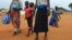 A South Sudan refugee family arrives at the UNHCR managed refugees reception point at Elegu, near the South Sudan-Uganda border, Aug. 20, 2016. Calls for a return to war have prompted Nespresso to suspend operations in South Sudan.
