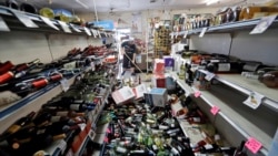 Bottles of wine are strewn in the middle of an aisle in the Eastridge Market in Ridgecrest, California, July 6,2019, after Friday night's 7.1-magnitude earthquake, which jolted an area from Sacramento to Mexico.