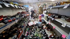 Bottles of wine are strewn in the middle of an aisle in the Eastridge Market in Ridgecrest, California, July 6,2019, after Friday night's 7.1-magnitude earthquake, which jolted an area from Sacramento to Mexico.