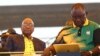 FILE - Newly-elected ruling African National Congress (ANC) party president, Cyril Ramaphosa, right, and former ANC president and South African President Jacob Zuma, left, attend the party's 106th birthday celebrations in East London, South Africa, Jan. 13, 2018.