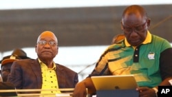 Newly-elected ruling African National Congress (ANC) party president, Cyril Ramaphosa, right, and former ANC president and South African President Jacob Zuma, left, attend the party's 106th birthday celebrations in East London, South Africa, Jan. 13, 2018.